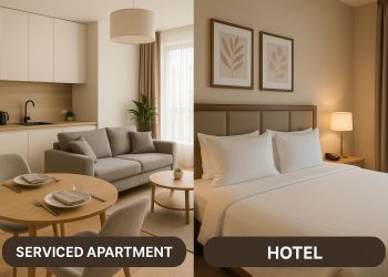 Modern serviced apartment living room with kitchen, highlighting comfort for travelers over hotels