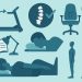 Man sitting upright at a desk practicing good posture with ergonomic office setup