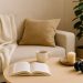 Cozy living room with soft lighting, houseplants, and books creating a relaxing home atmosphere