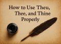Open old English grammar book with highlighted words thou, thee, and thine on a wooden desk